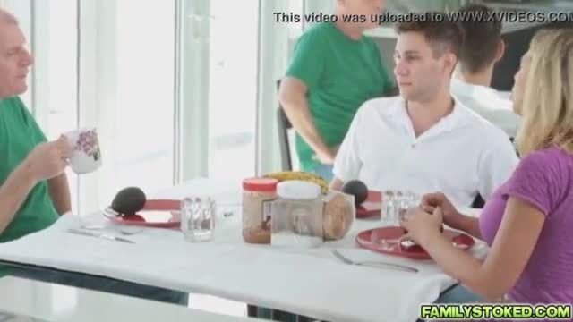 Mamma bear under the table to suck brads cock