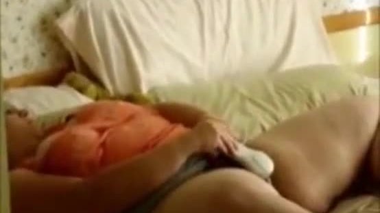 Voyeuring my 46 years old mom masturbating on bed