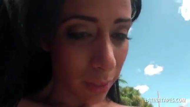 Oily latina showing big boobs and round butt outdoor